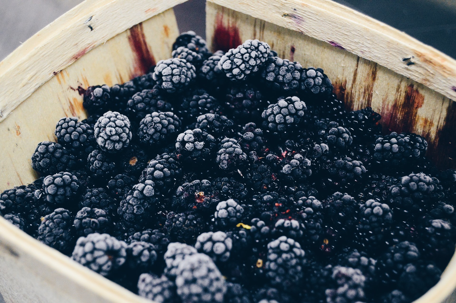 A punnet of frozen blackberries.